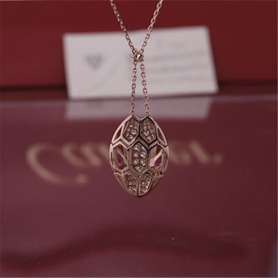Roman Serpenti necklace in 18 kt rose gold set with rubellite eyes and with pavé diamonds on the head